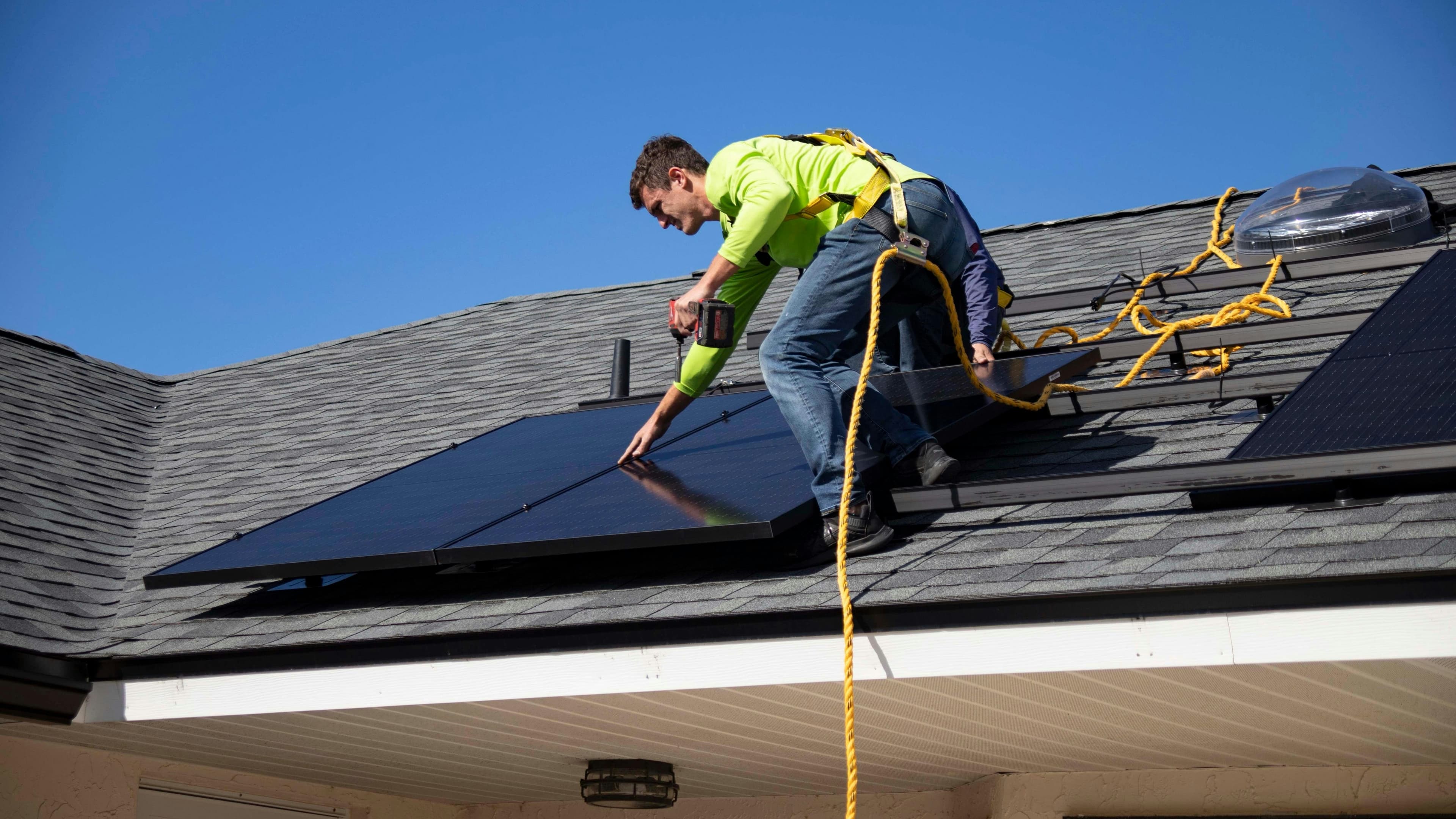 CEC accredited solar installer mounting panels on a residential roof